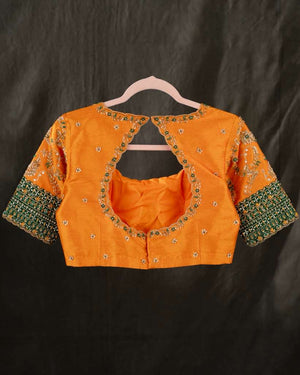 Kanchi soft silk saree in an evergreen green and light orange combo