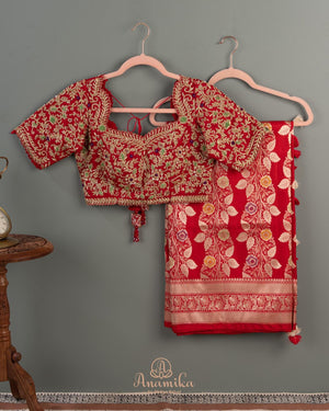 Red Banarasi saree with a heavy bridal zardosi work blouse
