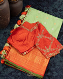 Gadwal Pattu saree in mint green and orange combo