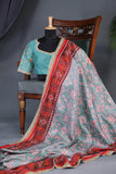 A classic patola in aqua blue with a striking contrast red