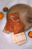 A beautiful vintage kanjeevaram in coppery rust with an ivory border
