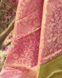 Stunning kanjeevaram in a dual tone peach pink color with meenakari border