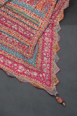 Designer Georgette Saree in hues of orange, peach, red and pink