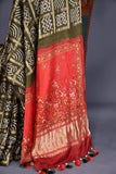 Bandini Gharchola in a lovely olive green shade with kalamkari pallu