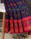 Patola silk saree in a lovely blue shade with pink border