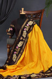 Yellow Gadwal Pattu saree with brown border and tanjore painting