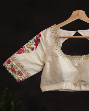 Off white blouse with beautifully designed Patola-inspired embroidery