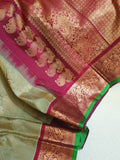 A Royal Gadwal kanchi saree in sage green with rich magenta border