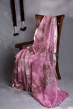 A beautiful rose pink tissue saree with an off white blouse