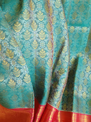 Turquoise Blue kanjeevaram saree with a contrast majenta pink border