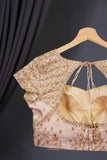 Stunning cocktail saree in champagne gold color