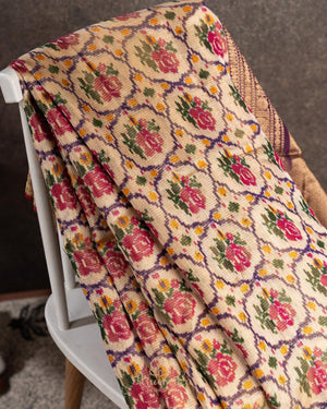 Light brown twill Patola saree with a contrast lavender border