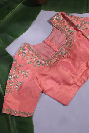 Green Kanjeevaram saree with a peach pink border