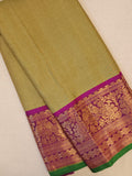 Royal Gadwal kanchiPattu saree in a beautiful parrot green and magenta combination