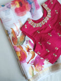 White floral pure silk saree with a contrast pink blouse