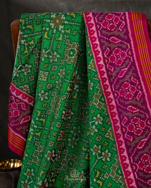 Pure Patola silk saree in a lovely shade of green and pink