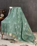 Organza saree in sage green with all over thread embroidery