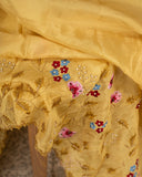 Lovely yellow tissue saree with beautiful thread embroidered border