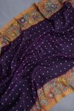 Deep purple bandini saree with a hand painted kalamkari border
