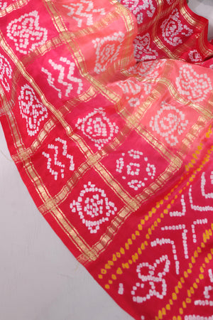 Bandini gharchola on gaji silk in hues of peach and pink