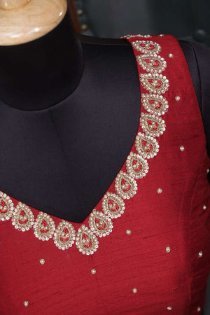 Red sleeveless blouse with handwork