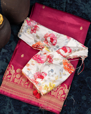 Raw mango pattu saree in a lovely shade of pink paired with a contrast floral blouse