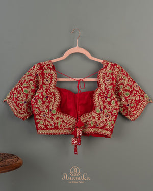 Red Banarasi saree with a heavy bridal zardosi work blouse