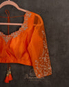 Orange Crush Tissue saree with a stunning net sleeves blouse