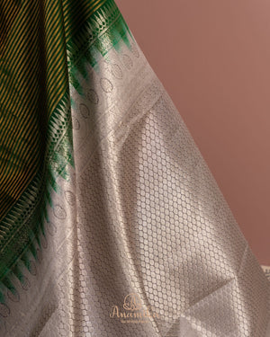 Dark green kanjeevaram saree with contrast grey border and pallu