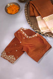 A beautiful vintage kanjeevaram in coppery rust with an ivory border