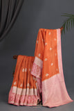 An exquisite Silk Saree in burnt orange and rose pink