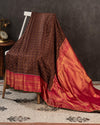 Brown kanjeevaram saree with a contrast dark pink border and Patola blouse