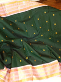 Kanjeevaram saree in bottle green with a baby pink border