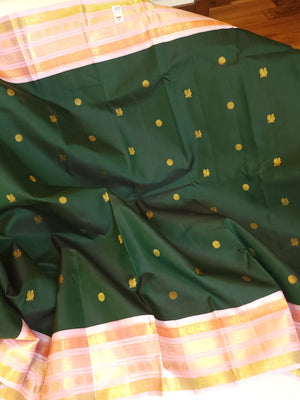 Kanjeevaram saree in bottle green with a baby pink border