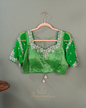 Parrot Green Crush Tissue saree with a stunning net sleeves blouse