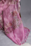 A beautiful rose pink tissue saree with an off white blouse
