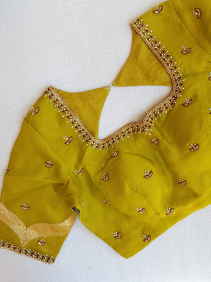 Raw mango organza saree in a unique brown and mustard green combo