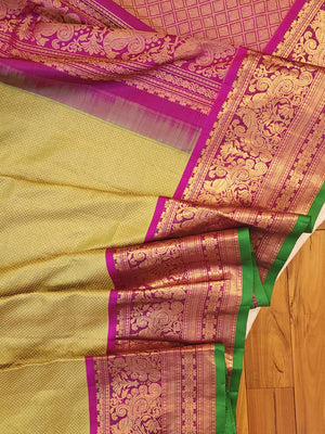 Royal Gadwal kanchiPattu saree in a beautiful parrot green and magenta combination