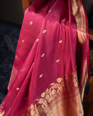 Raw mango pattu saree in a lovely shade of pink paired with a contrast floral blouse