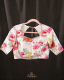 A beautiful Floral blouse in off white with intricately designed embroidery