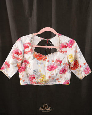 A beautiful Floral blouse in off white with intricately designed embroidery