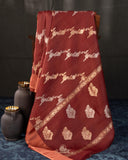 Rust Organza saree paired with a floral blouse