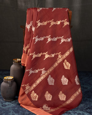 Rust Organza saree paired with a floral blouse