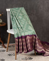 Sage Green Kanchi Bandini saree with a stunning purple border