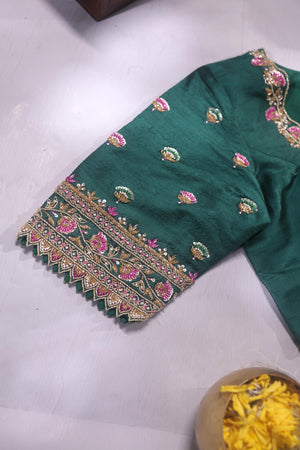 Raw Mango saree in bubble gum pink paired with a contrast dark green blouse