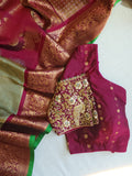 A Royal Gadwal kanchi saree in sage green with rich magenta border
