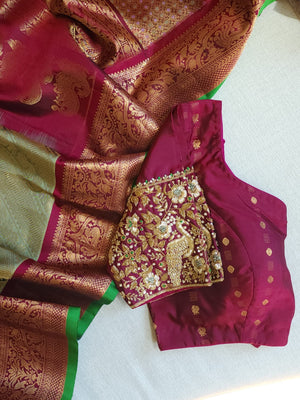 A Royal Gadwal kanchi saree in sage green with rich magenta border