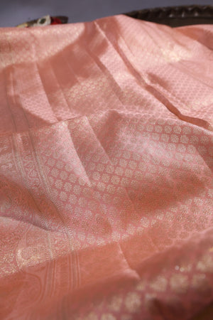 Green Kanjeevaram saree with a peach pink border