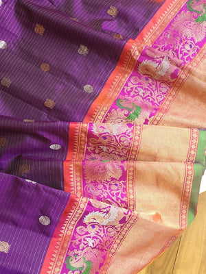 A Royal Gadwal kanchi saree in purple with contrast turning meena border