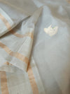 Flowy Malai silk saree in grey paired with a red Patola blouse